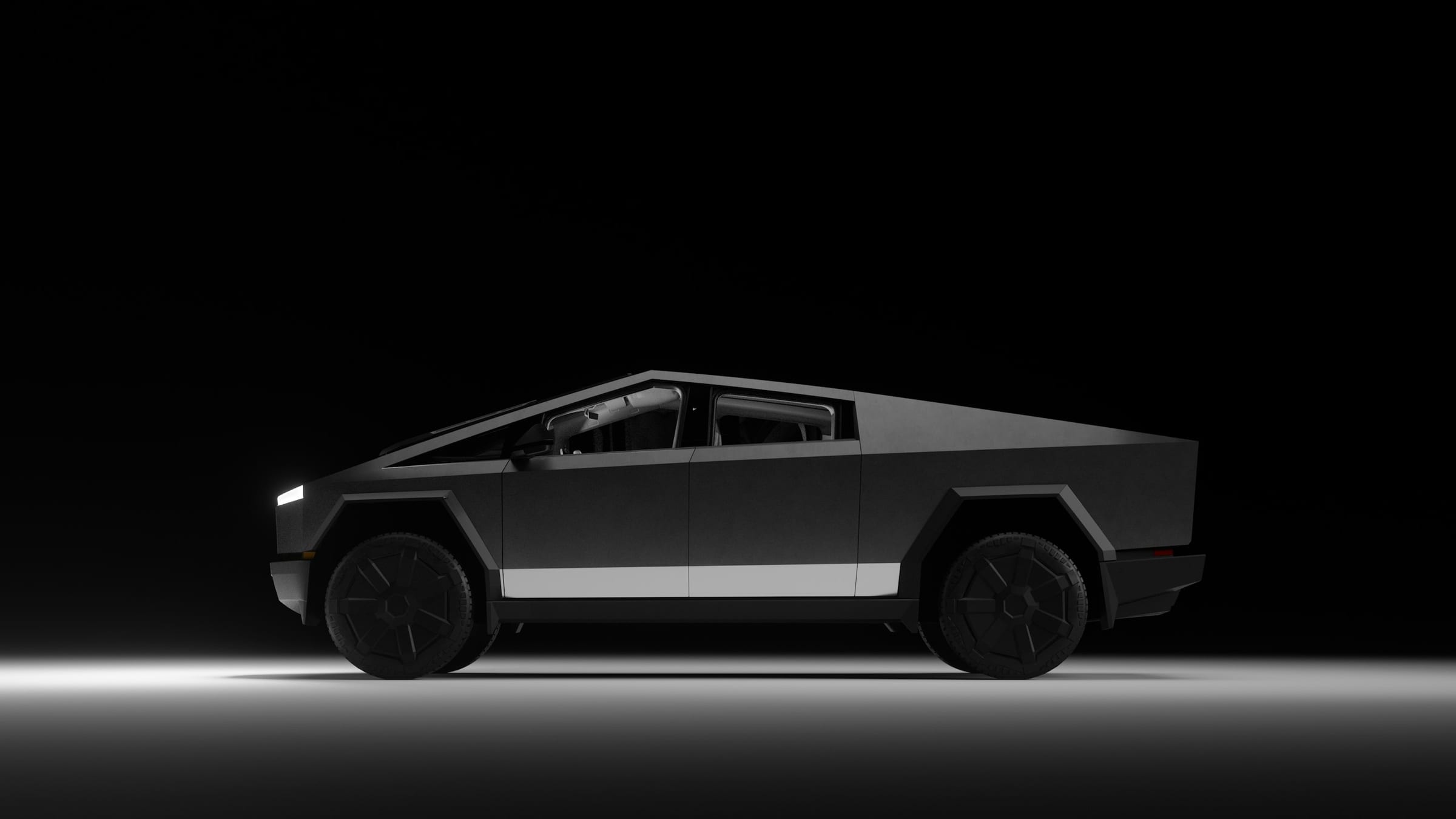 Tesla Cybertruck in profile against a dark studio backdrop