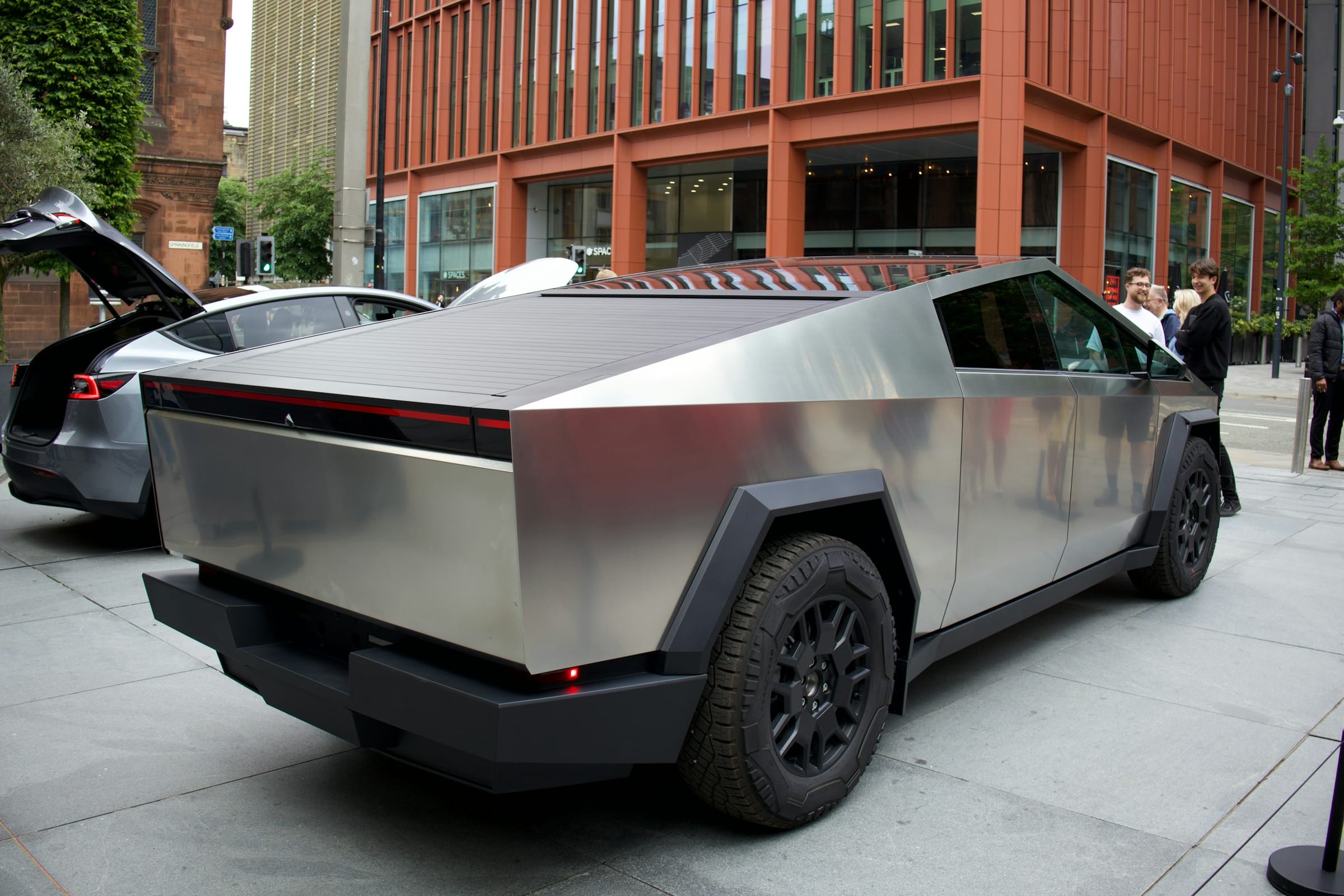 Rear view of a Tesla Cybertruck with the tonneau open