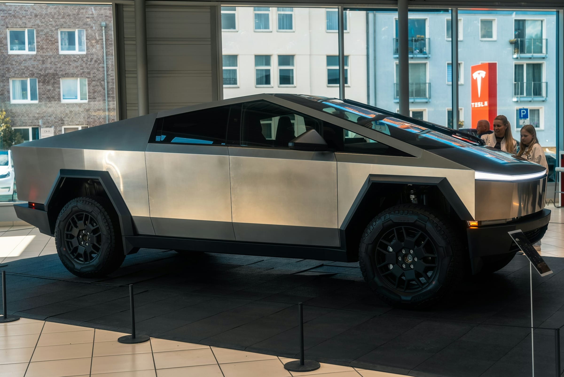 Tesla Cybertruck on display in a showroom, side view
