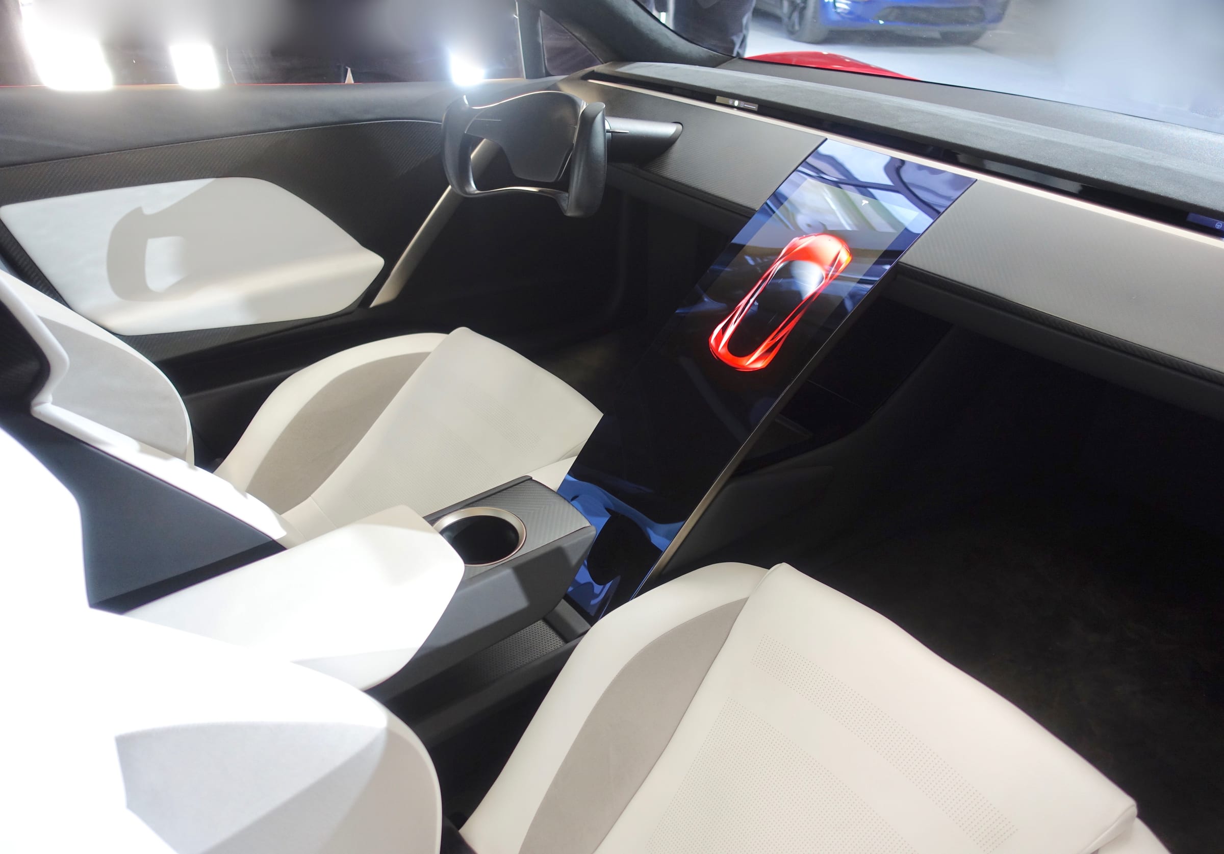Tesla Roadster prototype interior with white seats and central display