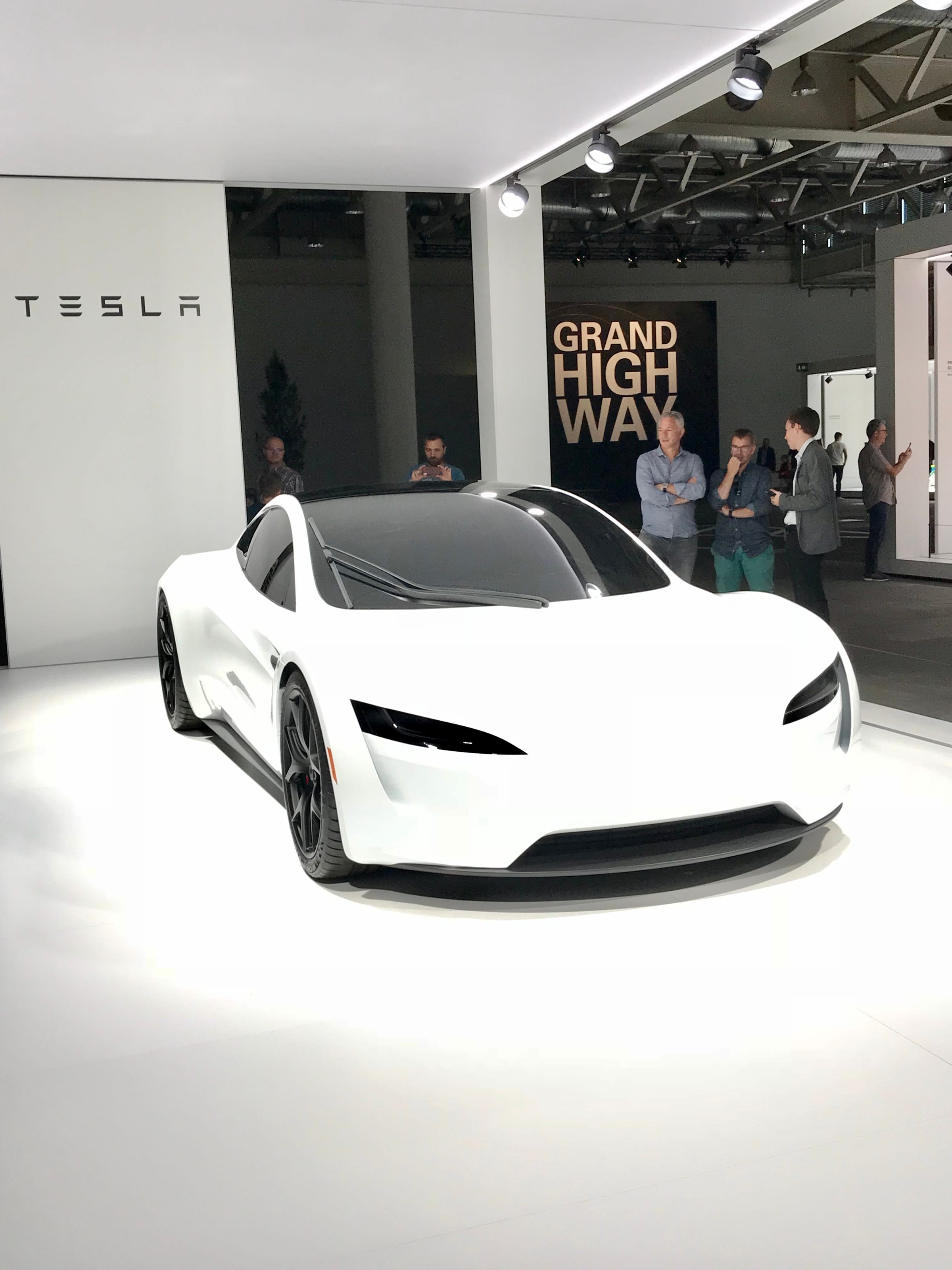 White Tesla Roadster prototype in a Tesla showroom